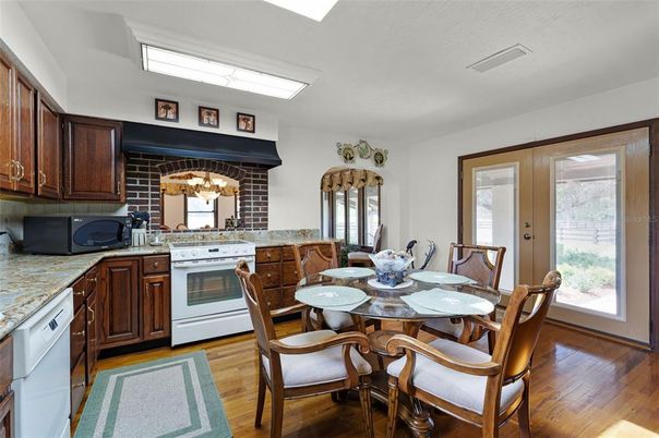Chandelier, Dining room, Fireplace, Interior, Kitchen, Wood Texture Flooring