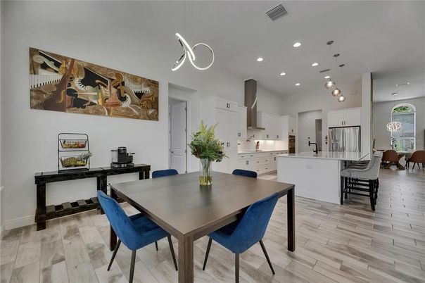 Dining room, Interior, Kitchen, Pendant Lights, Recessed Lighting, Stainless Steel Appliances, Wood Texture Flooring