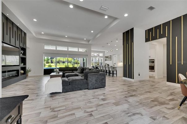 Dining room, Fireplace, Interior, Living room, Pendant Lights, Recessed Lighting, Wood Texture Flooring