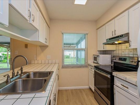 Interior, Kitchen, Tile Countertops, Wood Texture Flooring