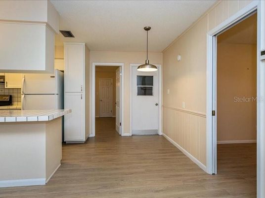 Interior, Kitchen, Pendant Lights, Tile Countertops, Wood Texture Flooring
