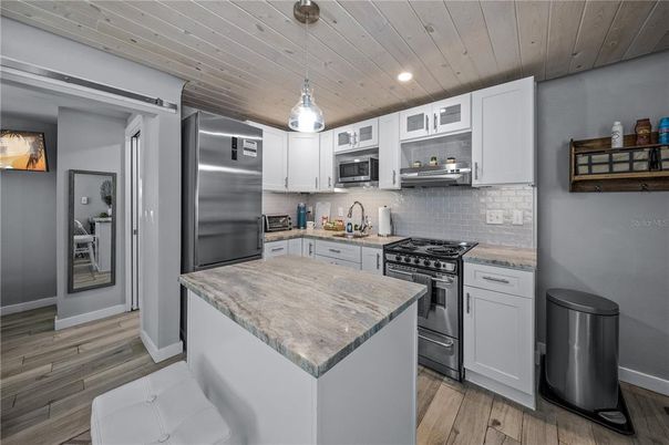 Interior, Kitchen, Pendant Lights, Recessed Lighting, Stainless Steel Appliances, Wooden Ceilings, Wood Texture Flooring