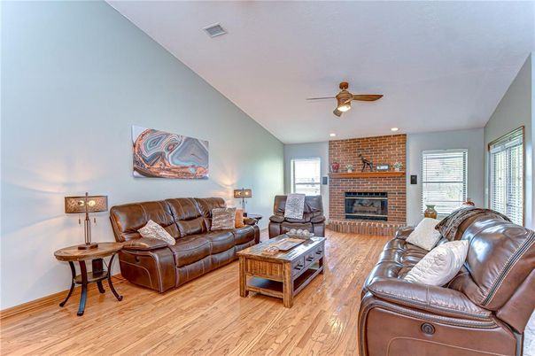 Fireplace, Interior, Living room, Recessed Lighting, Stone Walls, Wood Texture Flooring