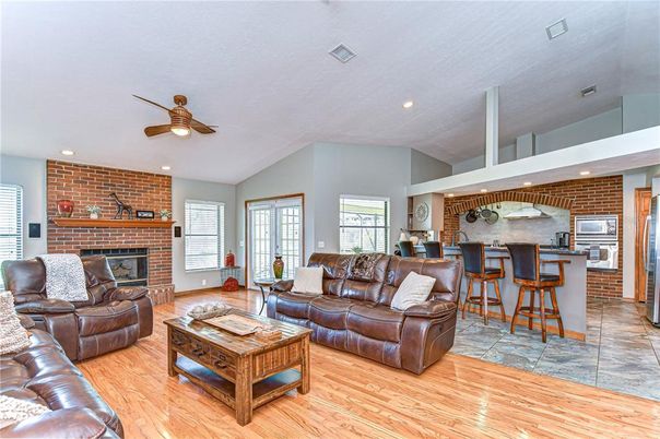 Fireplace, Interior, Kitchen, Living room, Recessed Lighting, Stone Walls, Wood Texture Flooring