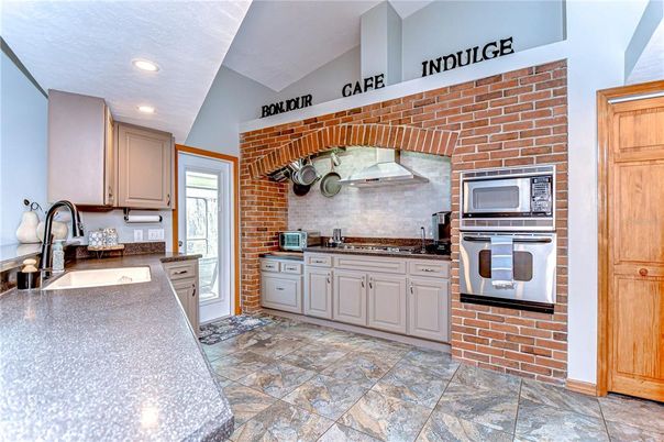Interior, Kitchen, Recessed Lighting, Stainless Steel Appliances, Stone Walls