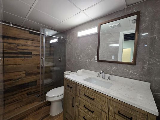 Bathroom, Glass Shower, Interior, Marble Walls, Wood Texture Flooring