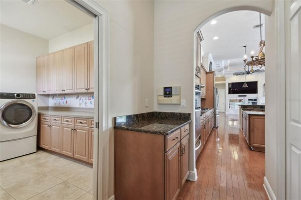 Chandelier, Interior, Kitchen, Recessed Lighting, Washer, Wood Texture Flooring