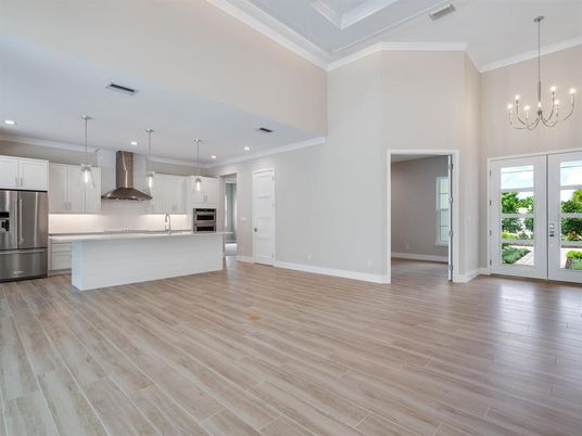 Chandelier, Empty room, Interior, Kitchen, Pendant Lights, Recessed Lighting, Stainless Steel Appliances, Wood Texture Flooring