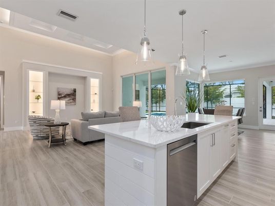 Dining room, Interior, Kitchen, Living room, Pendant Lights, Recessed Lighting, Stainless Steel Appliances, Wood Texture Flooring