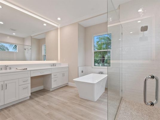 Bathroom, Dual Sink Vanities, Free Standing Baths, Glass Shower, Interior, Recessed Lighting, Wood Texture Flooring