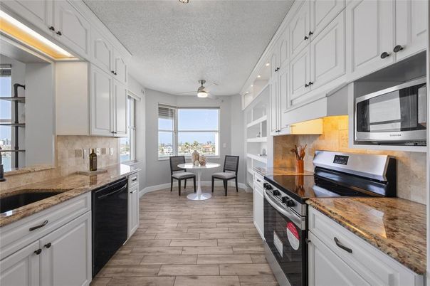 Dining room, Interior, Kitchen, Recessed Lighting, Stainless Steel Appliances, Wood Texture Flooring