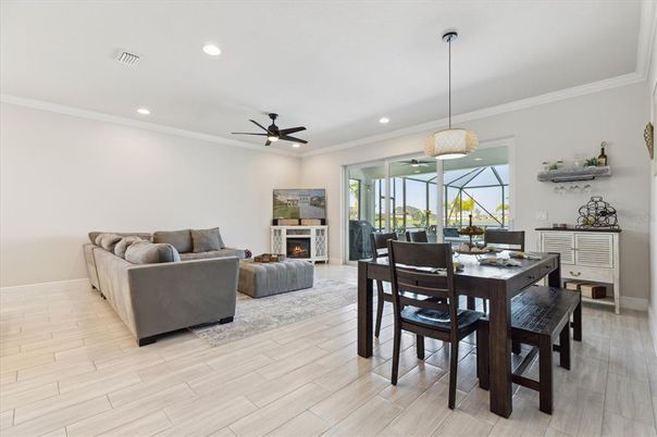 Dining room, Fireplace, Interior, Living room, Pendant Lights, Recessed Lighting, Wood Texture Flooring