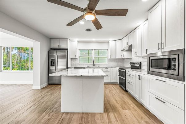 Interior, Kitchen, Recessed Lighting, Stainless Steel Appliances, Wood Texture Flooring