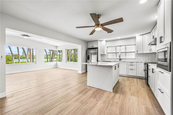 Interior, Kitchen, Recessed Lighting, Stainless Steel Appliances, Wood Texture Flooring