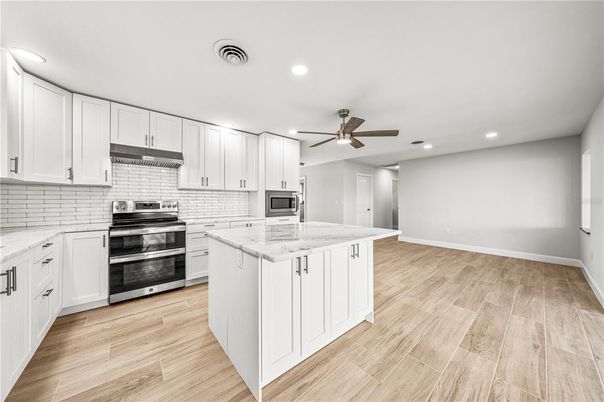 Interior, Kitchen, Recessed Lighting, Stainless Steel Appliances, Wood Texture Flooring