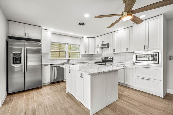 Interior, Kitchen, Recessed Lighting, Stainless Steel Appliances, Wood Texture Flooring