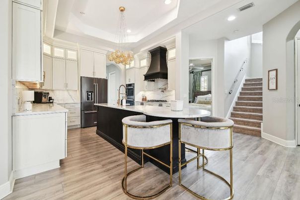 Dining room, Interior, Kitchen, Pendant Lights, Recessed Lighting, Stainless Steel Appliances, Wood Texture Flooring