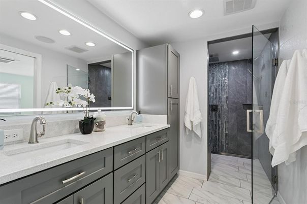 Bathroom, Dual Sink Vanities, Glass Shower, Interior, Marble, Recessed Lighting