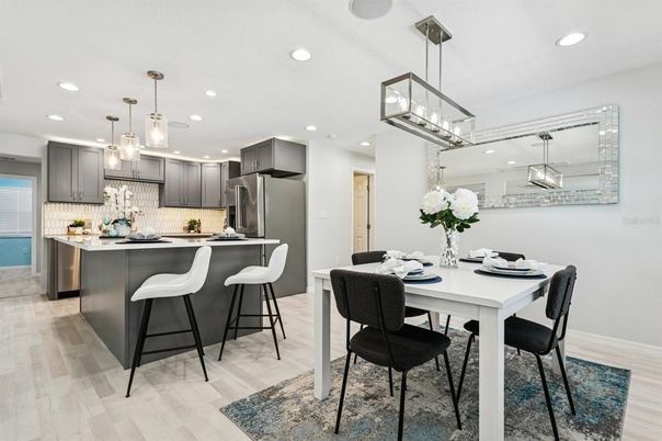 Dining room, Interior, Kitchen, Pendant Lights, Recessed Lighting, Stainless Steel Appliances, Wood Texture Flooring