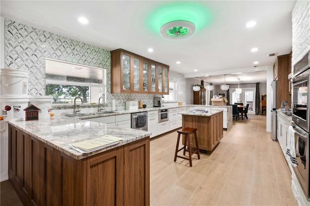 Dining room, Interior, Kitchen, Pendant Lights, Recessed Lighting, Stainless Steel Appliances, Wood Texture Flooring