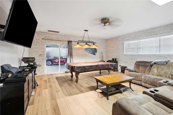 Billiard Table, Game Room, Interior, Living room, Pendant Lights, Stone Walls, Wood Texture Flooring