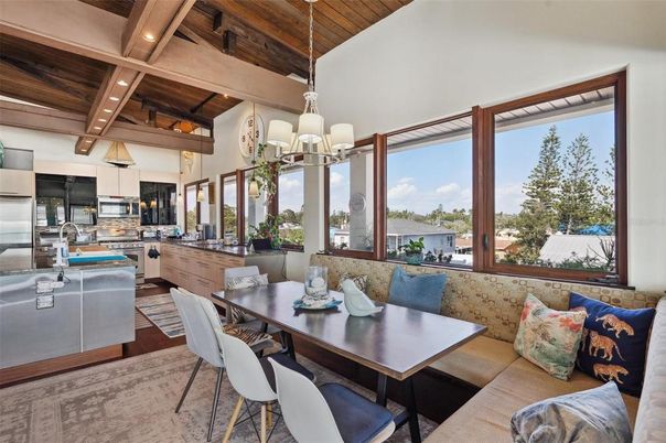 Chandelier, Dining room, Interior, Kitchen, Living room, Pendant Lights, Recessed Lighting, Stainless Steel Appliances, Wooden Beams, Wooden Ceilings, Wood Texture Flooring