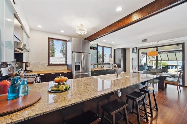 Dining room, Interior, Kitchen, Pendant Lights, Recessed Lighting, Stainless Steel Appliances, Wooden Beams, Wood Texture Flooring