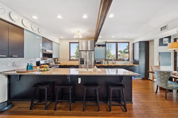 Dining room, Interior, Kitchen, Recessed Lighting, Stainless Steel Appliances, Wood Texture Flooring