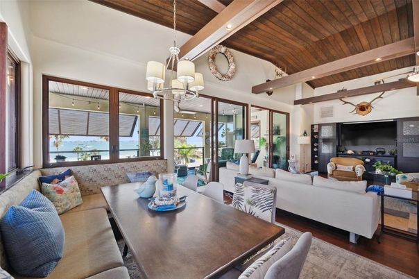 Chandelier, Dining room, Fireplace, Interior, Living room, Pendant Lights, Recessed Lighting, Wooden Beams, Wooden Ceilings, Wood Texture Flooring