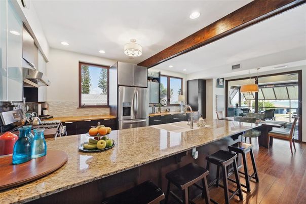 Dining room, Interior, Kitchen, Pendant Lights, Recessed Lighting, Stainless Steel Appliances, Wood Texture Flooring