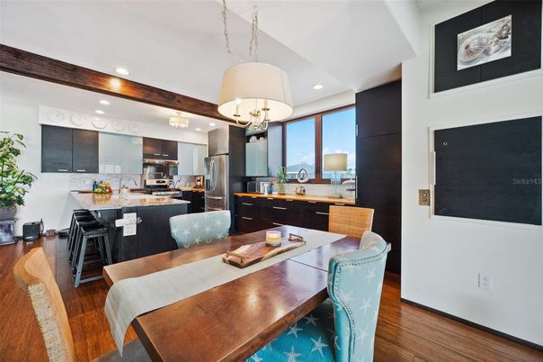 Dining room, Interior, Kitchen, Pendant Lights, Recessed Lighting, Stainless Steel Appliances, Wood Texture Flooring