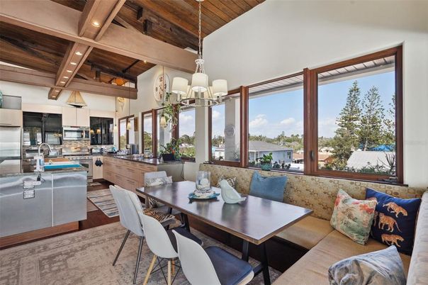 Chandelier, Dining room, Interior, Kitchen, Living room, Pendant Lights, Recessed Lighting, Stainless Steel Appliances, Wooden Beams, Wooden Ceilings, Wood Texture Flooring