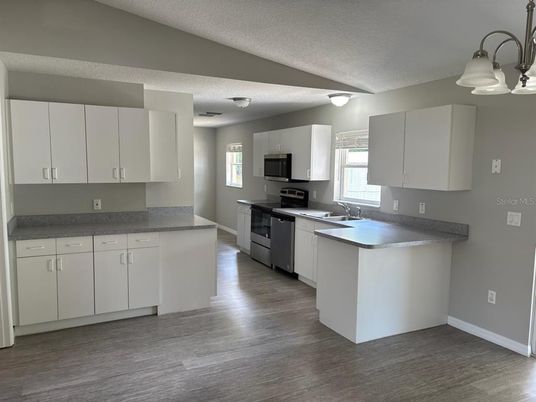 Interior, Kitchen, Pendant Lights, Stainless Steel Appliances, Wood Texture Flooring
