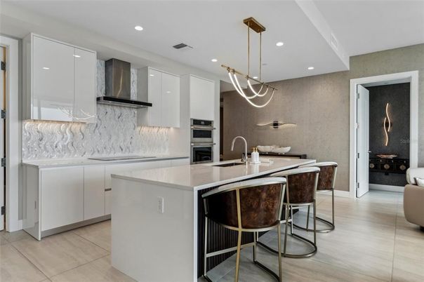 Interior, Kitchen, Marble Walls, Pendant Lights, Recessed Lighting, Stainless Steel Appliances