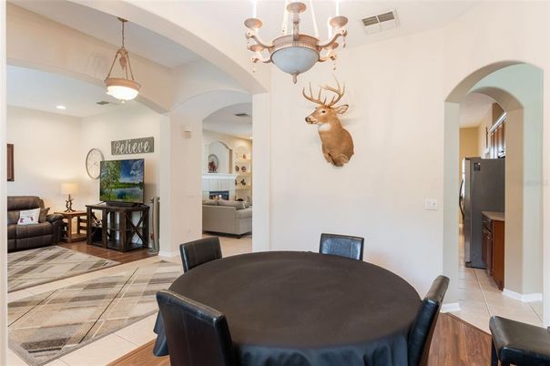 Dining room, Fireplace, Interior, Living room, Pendant Lights, Recessed Lighting, Wood Texture Flooring