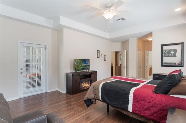Bedroom, Fireplace, Interior, Recessed Lighting, Wood Texture Flooring