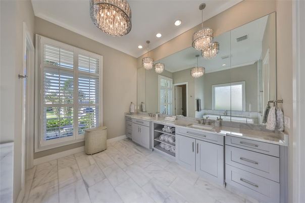 Bathroom, Chandelier, Dual Sink Vanities, Interior, Marble, Pendant Lights, Recessed Lighting