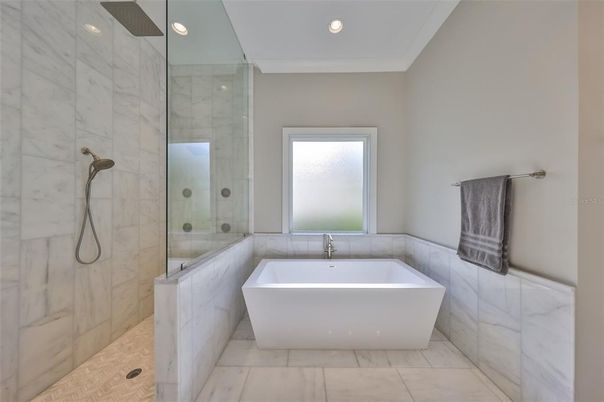 Bathroom, Free Standing Baths, Glass Shower, Interior, Marble, Marble Walls, Recessed Lighting