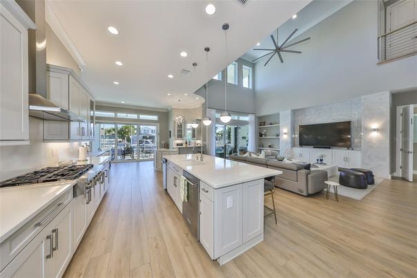 Dining room, Interior, Kitchen, Living room, Pendant Lights, Recessed Lighting, Stainless Steel Appliances, Wood Texture Flooring