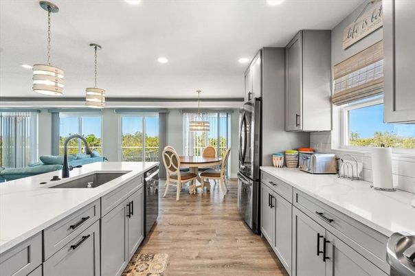 Dining room, Interior, Kitchen, Pendant Lights, Recessed Lighting, Stainless Steel Appliances, Wood Texture Flooring