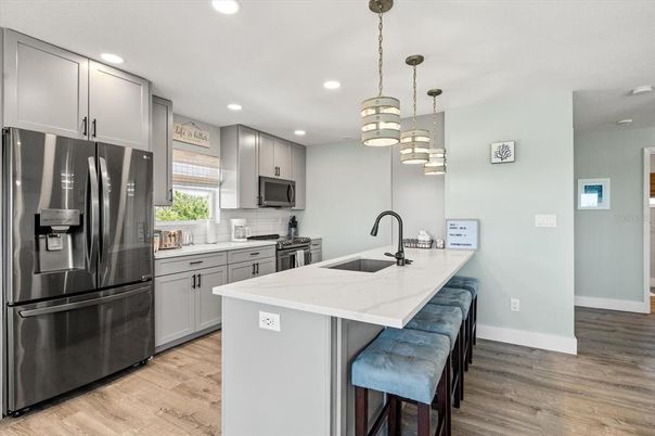 Interior, Kitchen, Pendant Lights, Recessed Lighting, Stainless Steel Appliances, Wood Texture Flooring