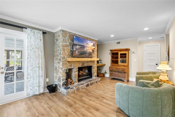 Fireplace, Interior, Living room, Recessed Lighting, Stone Walls, Wood Texture Flooring