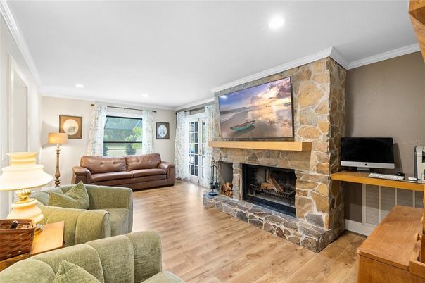 Fireplace, Interior, Living room, Recessed Lighting, Stone Walls, Wood Texture Flooring