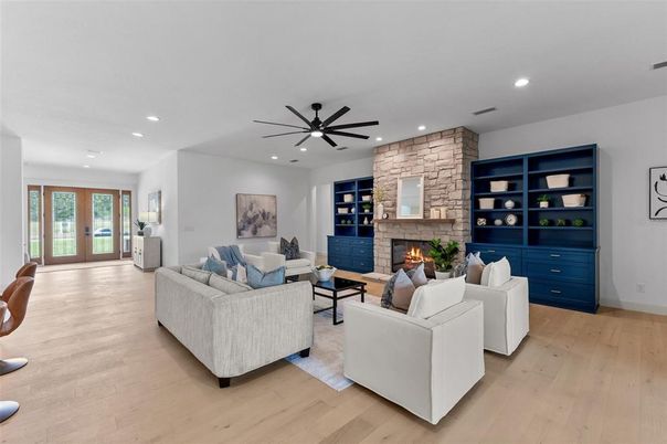 Fireplace, Interior, Living room, Recessed Lighting, Stone Walls, Wood Texture Flooring