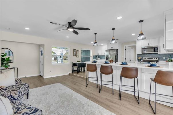 Dining room, Interior, Kitchen, Pendant Lights, Recessed Lighting, Stainless Steel Appliances, Wood Texture Flooring