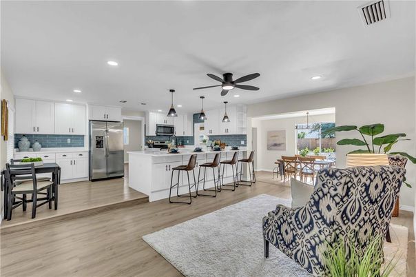 Dining room, Interior, Kitchen, Pendant Lights, Recessed Lighting, Stainless Steel Appliances, Wood Texture Flooring