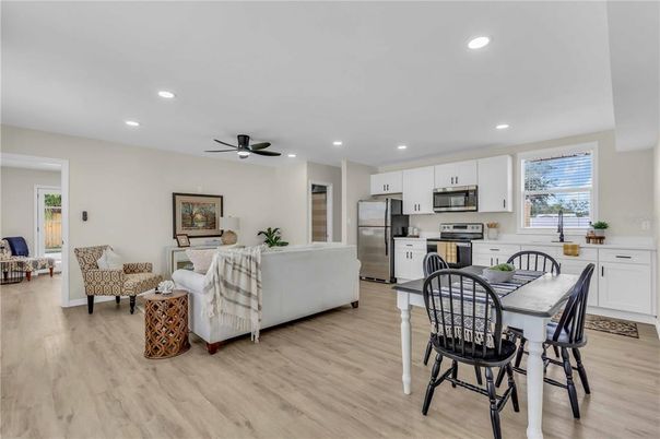 Dining room, Interior, Kitchen, Living room, Recessed Lighting, Stainless Steel Appliances, Wood Texture Flooring