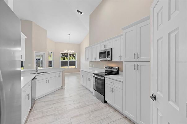 Chandelier, Interior, Kitchen, Pendant Lights, Stainless Steel Appliances, Wood Texture Flooring
