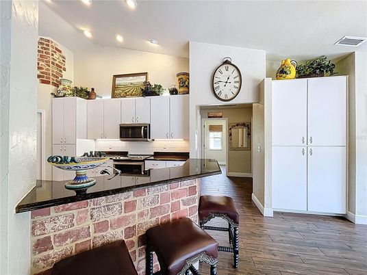 Interior, Kitchen, Recessed Lighting, Stainless Steel Appliances, Stone Walls, Wood Texture Flooring