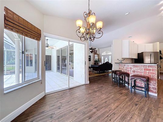 Chandelier, Fireplace, Interior, Kitchen, Piano, Recessed Lighting, Wood Texture Flooring